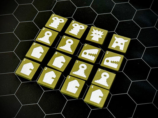 Green QuoDrox tiles showing the front designs on a black hex map.