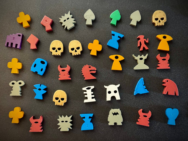 A bunch of mulit-colored quodrox meeples