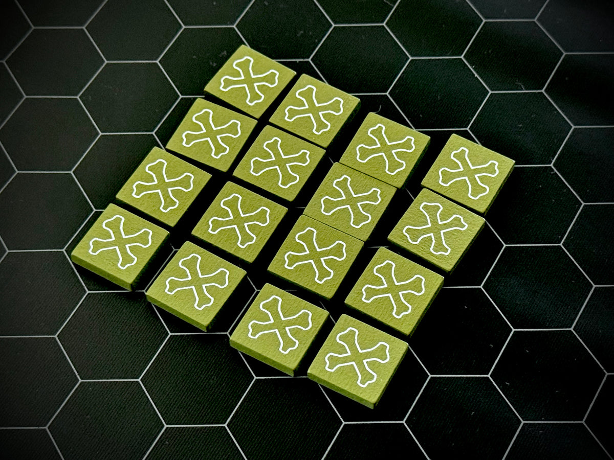 Green QuoDrox tiles showing the crossbones on the back on a black hex map. 