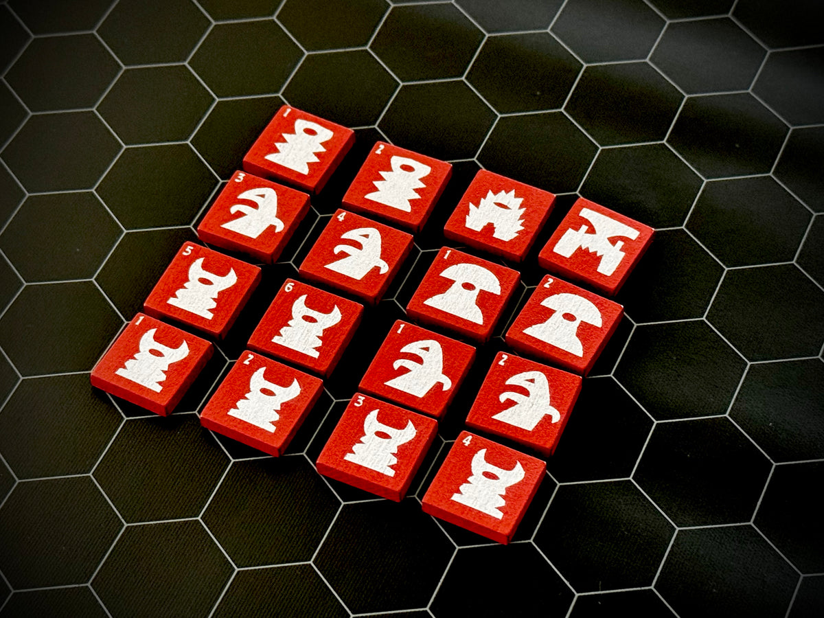 Red QuoDrox tiles showing the front designs on a black hex map. 