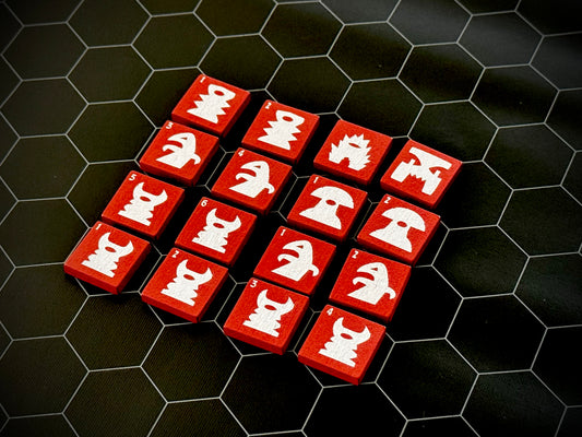 Red QuoDrox tiles showing the front designs on a black hex map. 