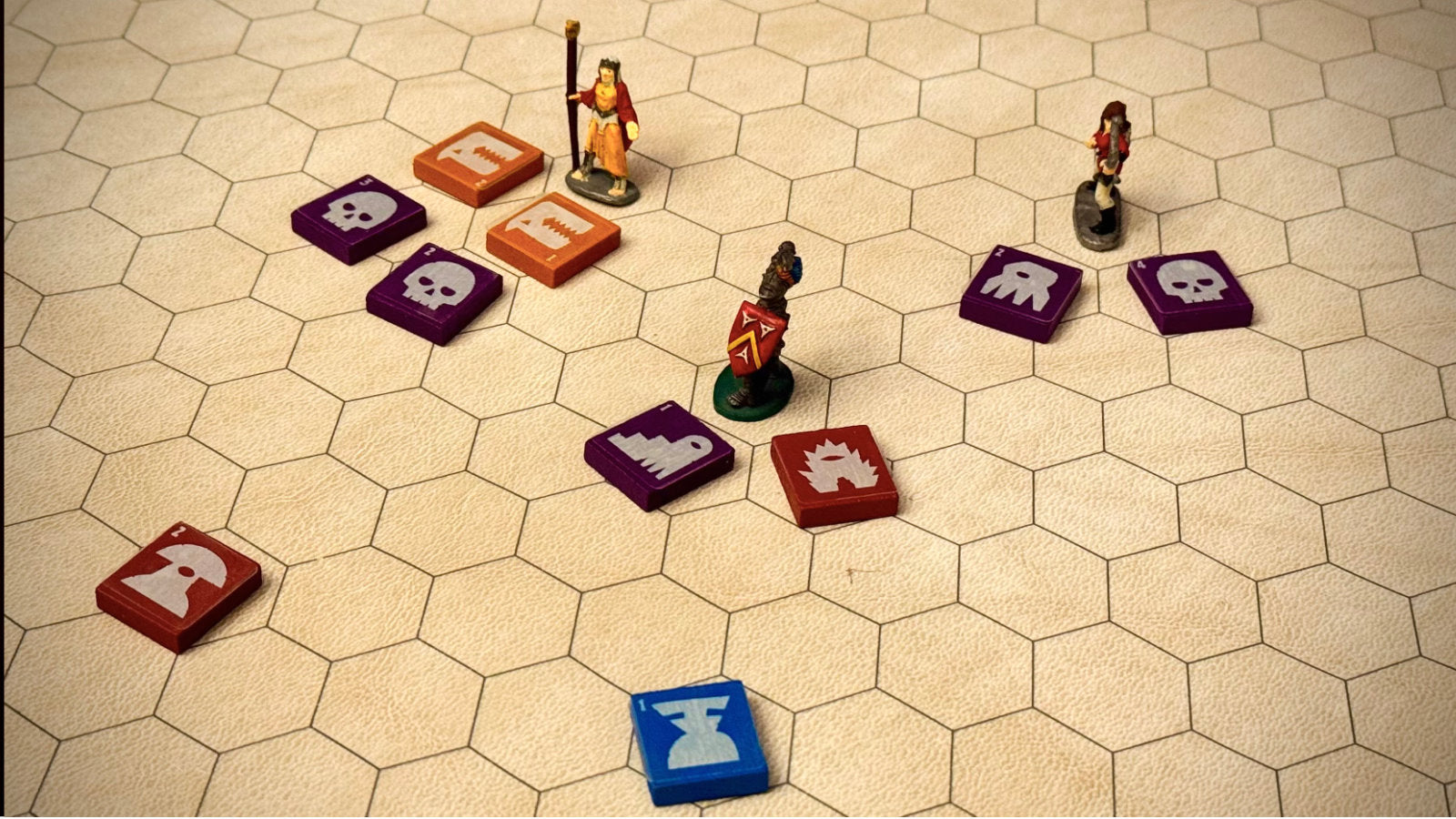 QuoDrox tiles arranged on a hex battle map with miniatures